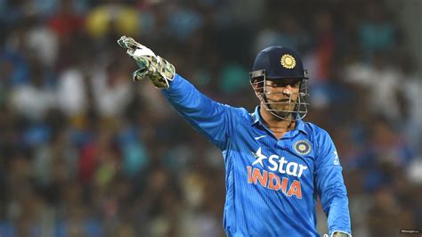 Ms Dhoni Is Wearing Blue Sports Dress And Helmet Standing In Blur