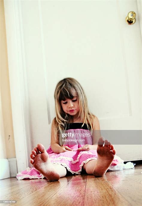 Girl With Dirty Feet Siting High Res Stock Photo Getty Images