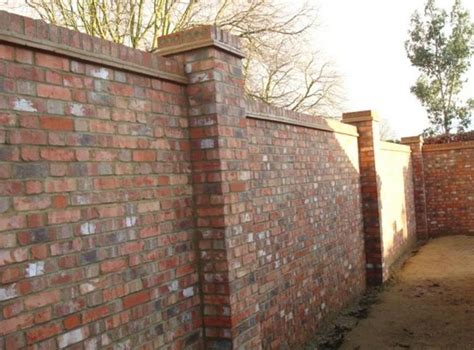 Brick Wall With Two Brick Piers And On Edge Headers For Coping Brick