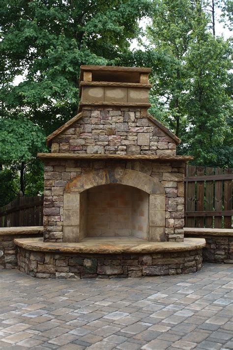 Stacked Stone Outdoor Fireplace With Hearth And Seating