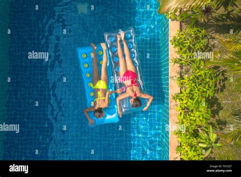 Aerial Top View Above Swimming Pool Woman In Yellow Bikini And Woman