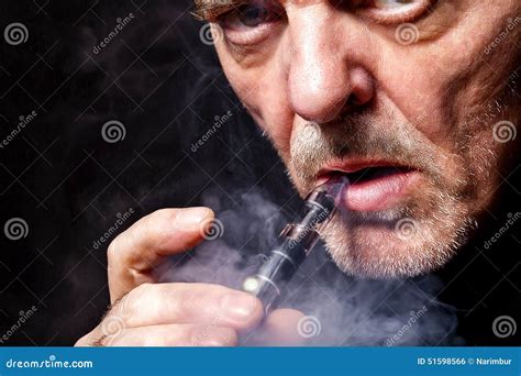Portrait Of A Man Smoking An E Cigarette Stock Photo Image Of Liquid