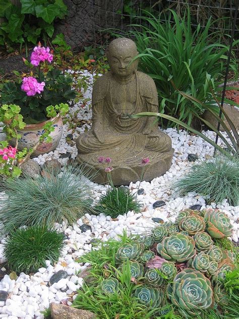 The japanese rock garden or dry landscape garden, often called a zen garden, creates a miniature stylized landscape through carefully composed arrangements of rocks, water features, moss, pruned trees and bushes, and uses gravel or sand that is raked to represent ripples in water.a zen garden is usually relatively small, surrounded by a wall, and is usually meant to be seen while seated. 65 Philosophic Zen Garden Designs - DigsDigs