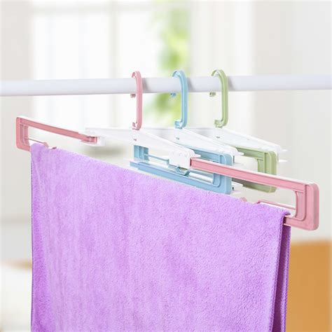 Drying racks also help keep delicate fabrics looking new by avoiding the sometimes harsh heat of an electric dryer. Folding Hanger Cloth Racks Portable Travel Hanger Racks ...