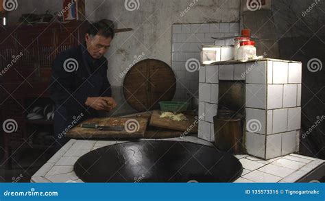Chinese Old Man Cooking In Kitchen At His Home Countryside Yunnan