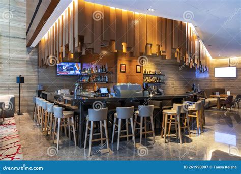 Modern Cozy Bar Interior with Wooden Panels in Restaurant Editorial