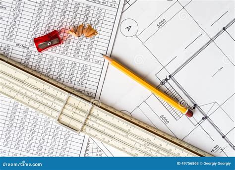 Architectural Drawings Slide Rule And A Sharpener With A Pencil Stock