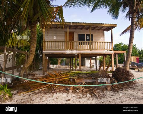 Caye Caulker Belize Traditional Wooden House On Stilts On The Beach