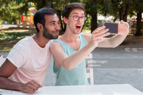 A Couple Of Two Young Men Taking A Selfie And Enjoying In The Park High