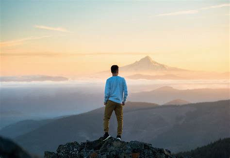Man Standing On Top Of Mountain Image Free Photo