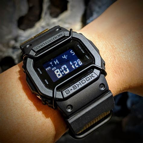 Remove the battery with gloves and clean the battery compartment with a toothbrush and vinegar. Casio G-shock DW-5600BB military mod (JaysAndKays strip ad ...