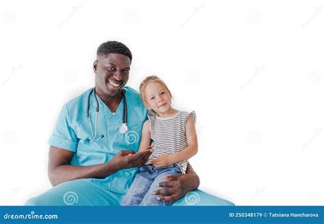 Portrait Of An African American Pediatrician Holding A Little Girl