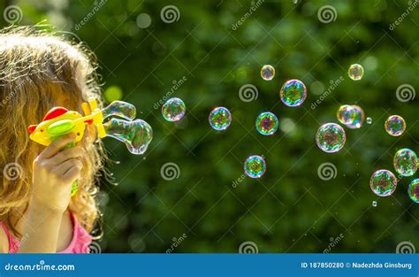 Bubble Little Girl Blowing Bubbles In The Summer Stock Photo Image