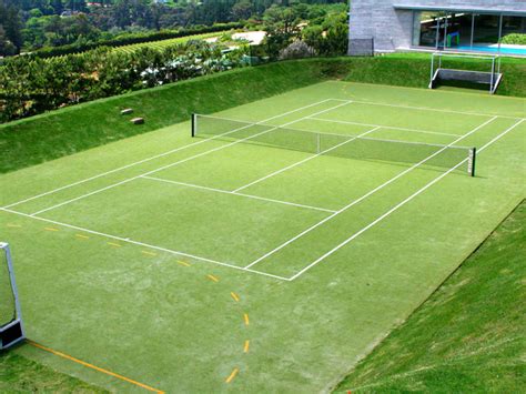 Tennis ball on tennis grass court bounced. Artificial Grass Carpets Sport Flooring Synthetics Turf ...
