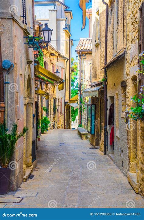 Typical Italian Cobblestone Street With Traditional Buildings And