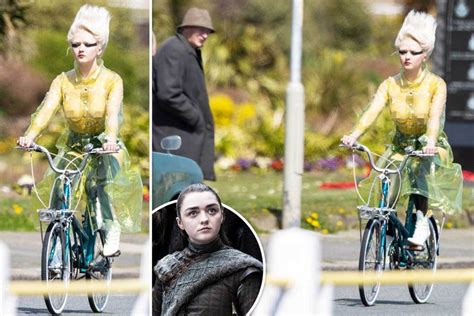 Maisie Williams Rides A Bike Wearing A See Through Mac And No Bra As