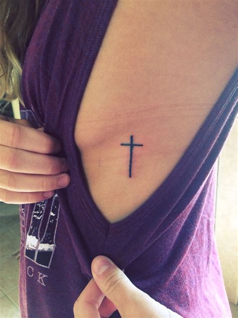 Another way to get inked with cross tattoos is combining names and quotes in your tattoo design that will make it a lot more cooler than ever. Small cross tattoo | Cross tattoo, Cross rib tattoos, Boob ...