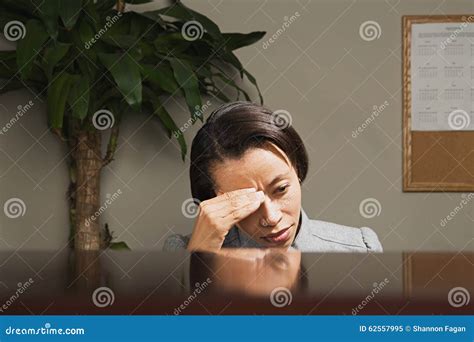 Businesswoman With Her Head In Her Hands Stock Image Image Of Indoors