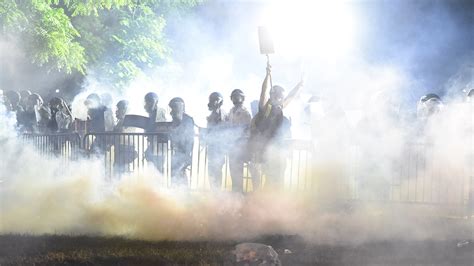 Demonstrators steal a metropolitan police riot shield while attempting to enter the u.s. George Floyd protesters undeterred by US curfews: Live updates | George Floyd death News | Al ...