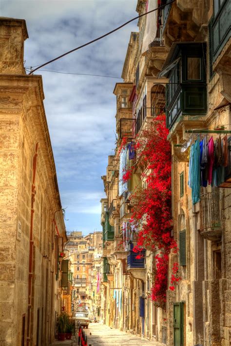 Nurodyti darbo grafiką galima nurodytu telefonu: Street in Valletta, Malta | Colourful flowers down a side ...