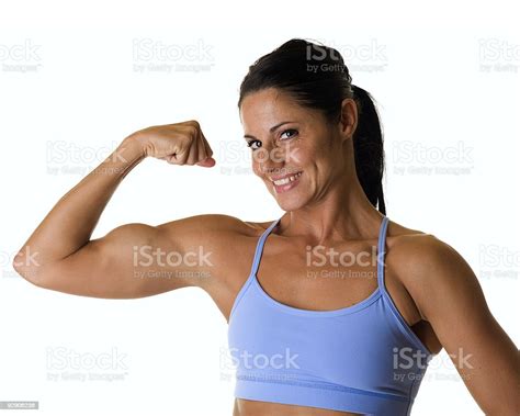 Attractive Female Flexing Bicep Stock Photo Download Image Now
