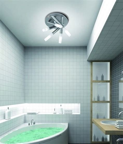 The answer is a bathroom ceiling fan with the light mounted into it. Brushed Steel Tubular Bathroom IP44 Light