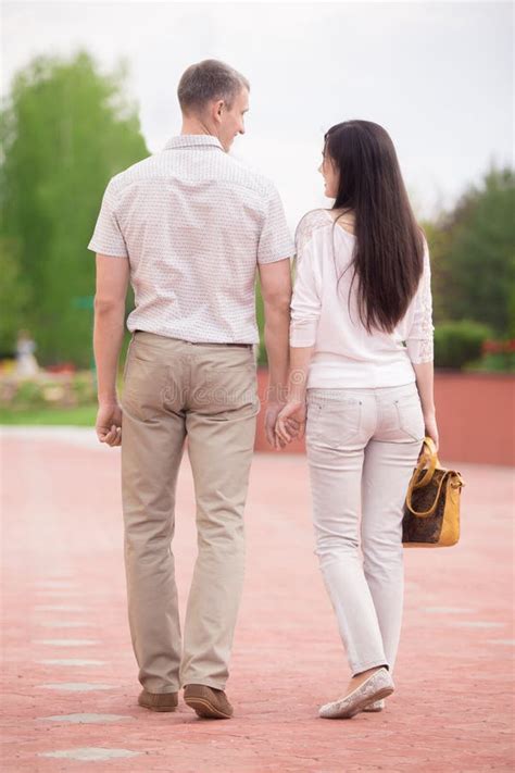 Couple Walking Hand In Hand Stock Photo Image Of Park Girl 55778468