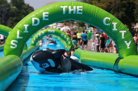 · get your carnival vibes on, because we are making your october splashingly fun! 'Slide the City' bringing giant slip-and-slide event to ...