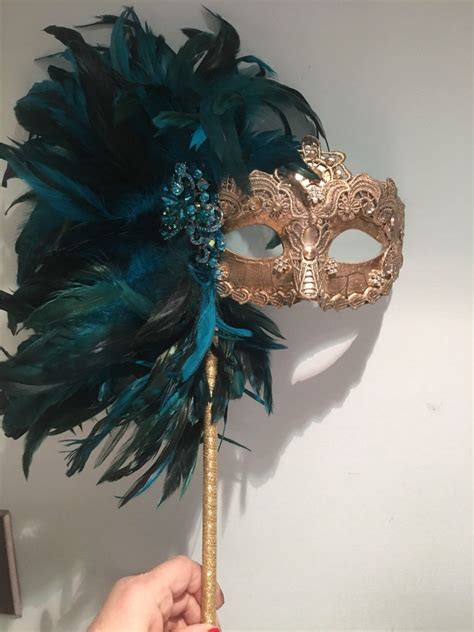 Mask On A Stick Feather Mask Mardi Gras Etsy Masks Masquerade Masquerade Mask Diy