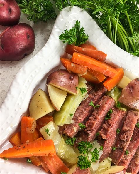 First, add the onion and garlic to the inner pot. Instant Pot Corned Beef and Cabbage - Momma Lew