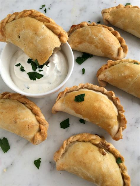 Philly Cheesesteak And New England Clam Empanadas Pickled And Poached