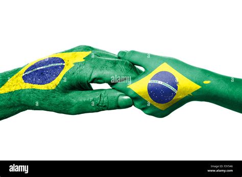 Two Hands And Brazilian Flag Stock Photo Alamy