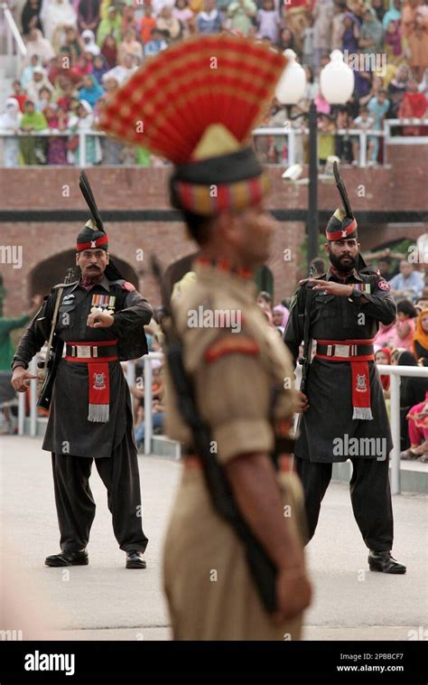 An Indian Border Security Force Soldier Foreground And Pakistan