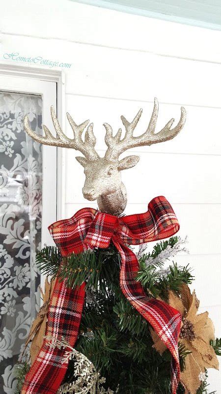 rustic deer themed christmas tree  front porch