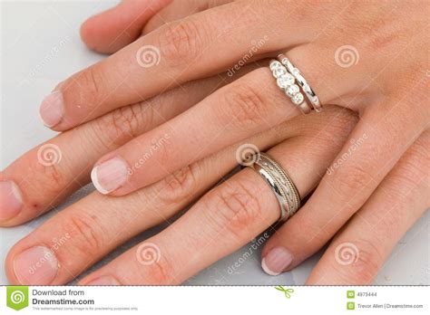 Gimmal rings, a ring that features two to three links that fit together that form one ring and posie rings, metal bands that featured a short inscription in most western cultures, particularly in the uk, you would wear your wedding ring on the fourth finger of your left hand. Wedding Rings On Hands Stock Images - Image: 4973444