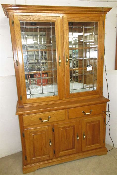 Same model are available in solid wood. Albrecht Auctions | Oak Two-Piece Lighted China Cabinet with Leaded Glass Doors, Two Glass ...