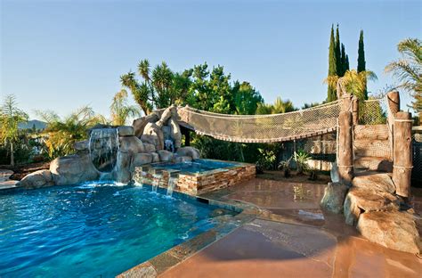 This one comes in elegant rotomolded design for both strength and durability. 20 Awesome Swimming Pools With Water Slides | Homes of the ...