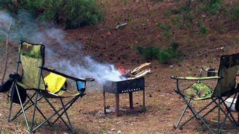 Camping Place In Forest Camping Chairs And Barbecue In Forest Smoke From Bonfire In Mangal