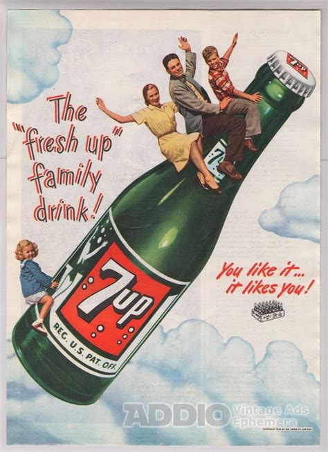 An Advertisement For 7up With Three People Sitting On Top Of A Large