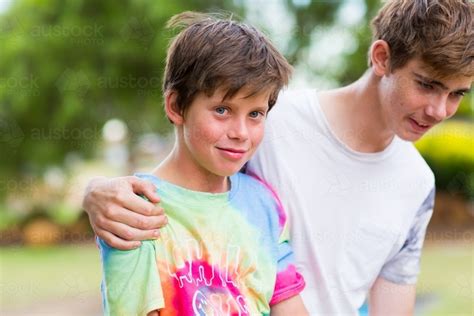 Image Of Teen Boy With Arm Around His Little Brother Austockphoto