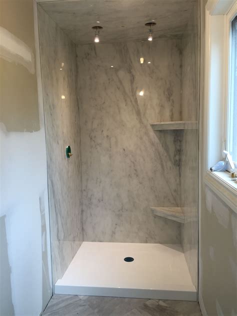 A Subtle Grey Marble Ite Shower Paired With A Bright White Cultured