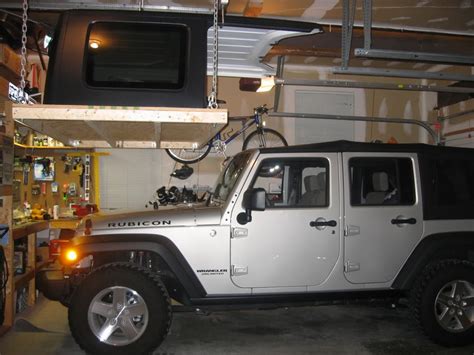 The jeep trip is a neat aspect to the book, and kudos to his good natured wife for suggesting it. JK Forum Member Comes Up With Nifty Hardtop Hoist - JK-Forum