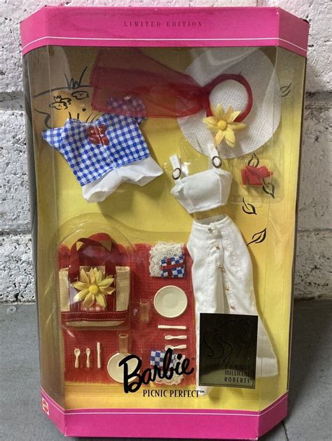 A Barbie Doll In A Box With Clothes And Accessories