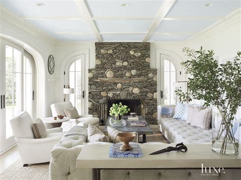 Transitional White Living Room With Stacked Stone Fireplace Luxe
