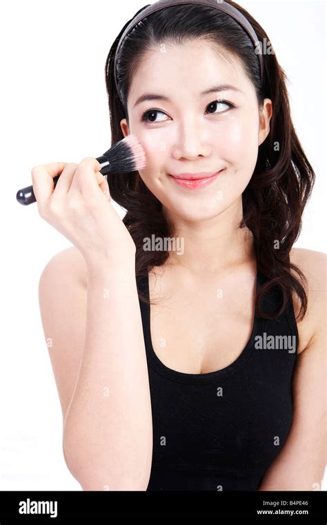 Young Woman Applying Make Up Stock Photo Alamy