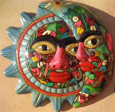 Modern reflections iron sun wall décor features iron construction, distressed gray finish, features several straight and curved iron solar rays, also features a carved face in the center. Ceramic sun wall hanging from Mexico. @ Haitian Art | Cuban art, Moon wall art, Sun art