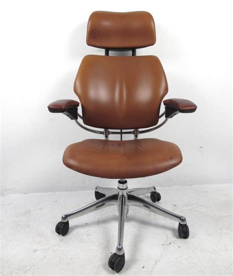 This plush beauty features 100% polyester fabric upholstery in your choice of color. Midcentury Style Ergonomic Leather Swivel Desk Chair at 1stdibs