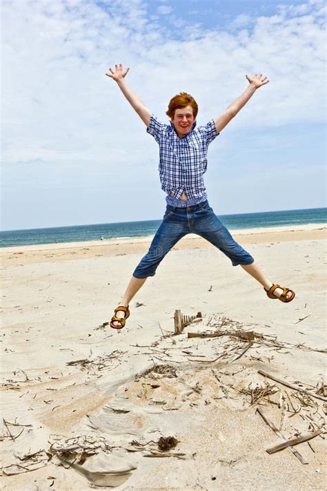 Boy Enjoys The Beach And Jumps Stock Image Image Of Energy Children