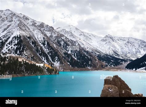 Big Almaty Lake In Kazakhstan In A Cold Winter Day Snow Visible Around