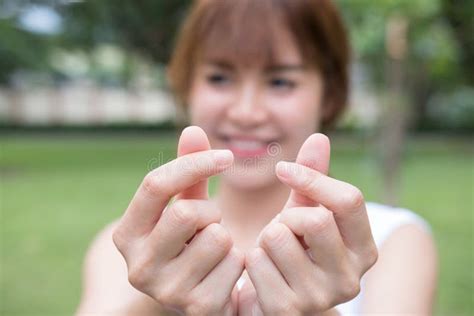 Young Woman Making A Heart Gesture With Her Fingers Asian Girl Stock